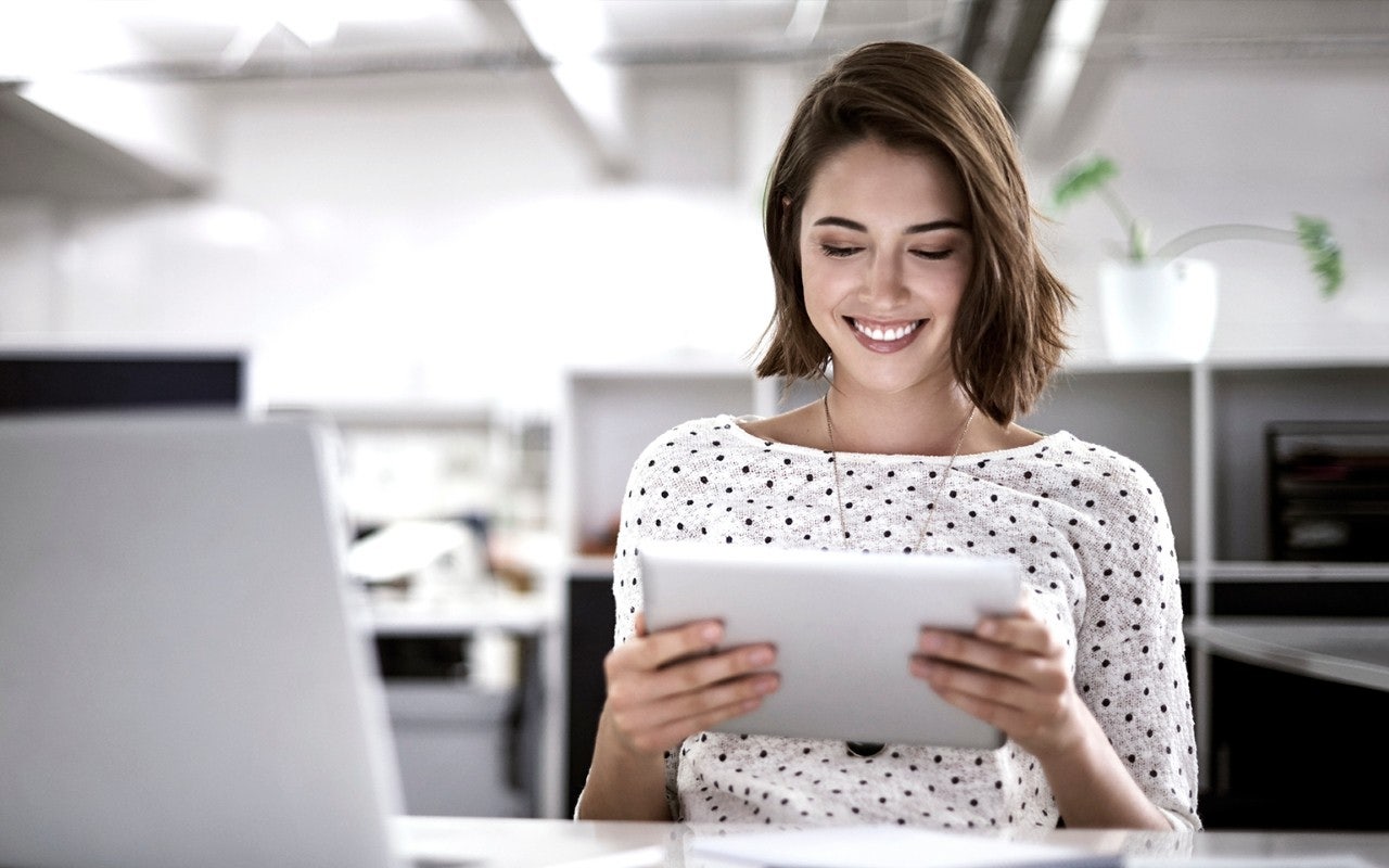 Woman printing from computer tablet