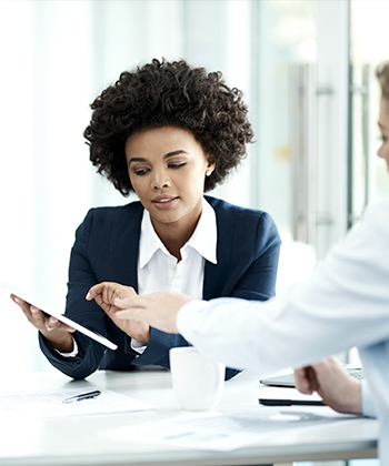 colleagues reviewing images in a meeting