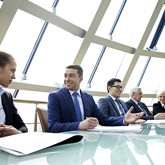 company members at a board meeting