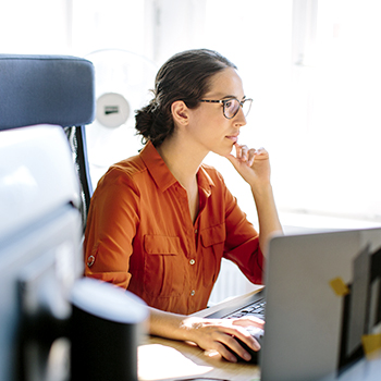 office workers looking at a laptop