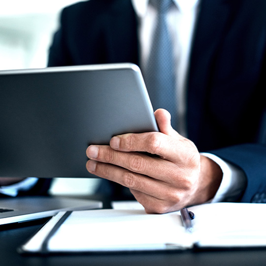 man working with his tablet