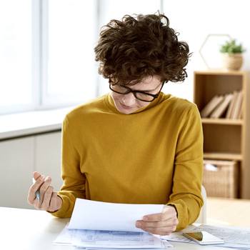 Woman reading printed document
