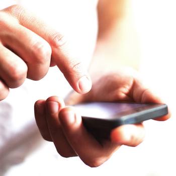 Online Privacy Statement close up of a hand typing on a smartphone