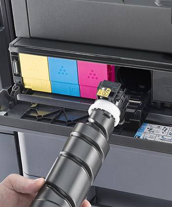 key toner cartridge being inserted into printer