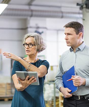 Stay informed woman in a warehouse
