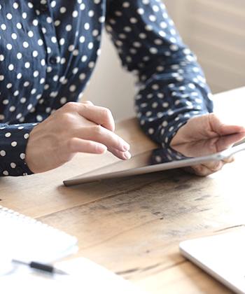 TASKalfa Upgrade Series Press Release hands holding a tablet