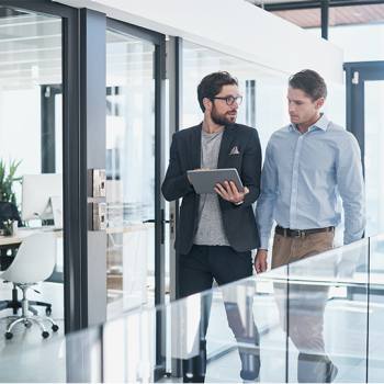 What are the benefits of a paperless office? two men walking and talking