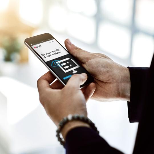 The True Advantages of Archiving Your Data Digitally man watching smartphone