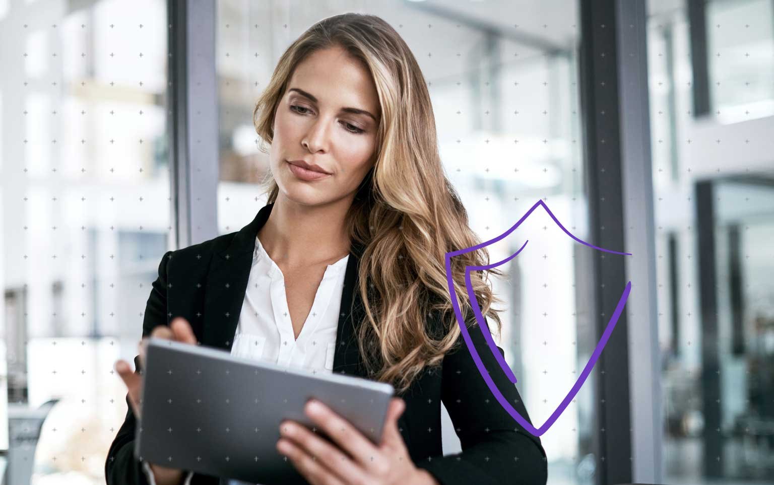 woman pointing at screen with man sitting next to her