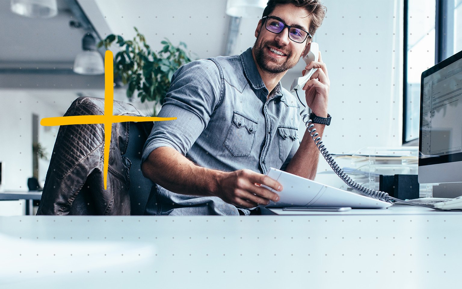 Man using mobile phone at desk