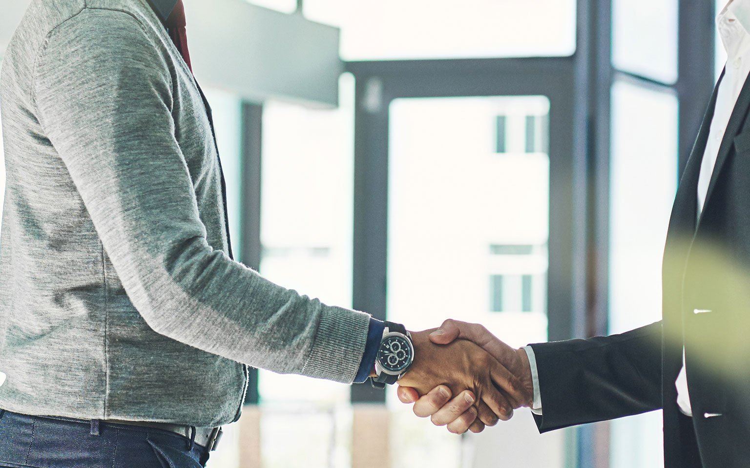 Your Standard Warranty two men shaking hands