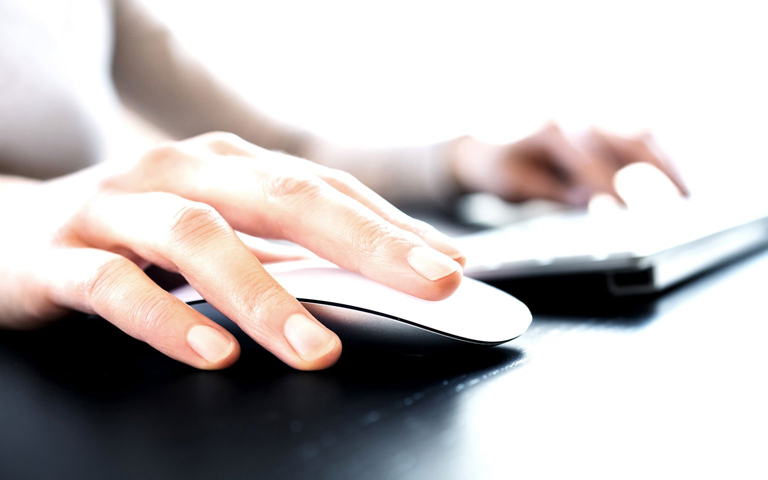 Privacy & Cookie Centre close up of hands typing on a laptop