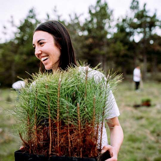 Kyocera woman holding plants Kyocera woman holding plants